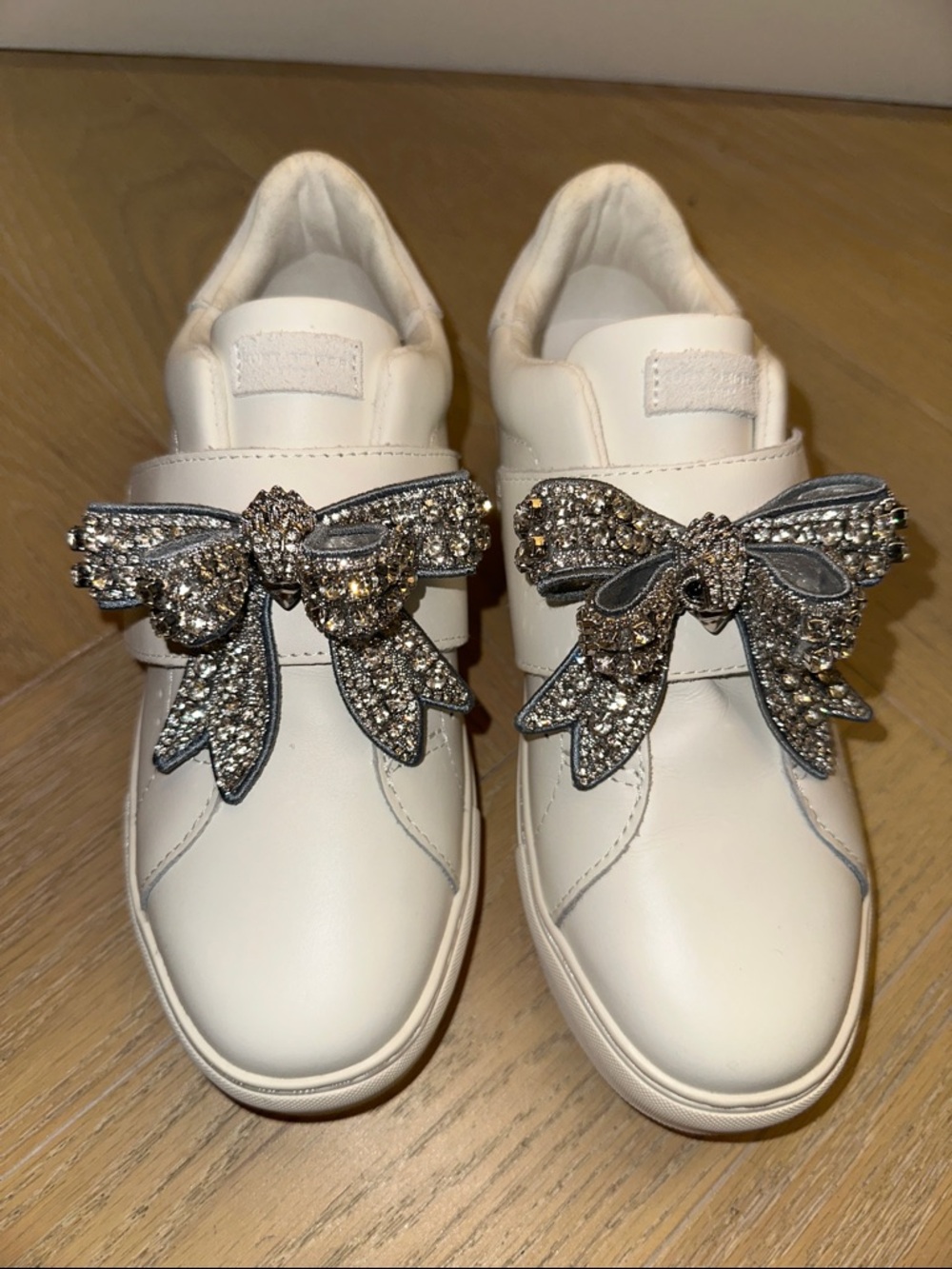 Kurt Geiger White Slip-On Sneakers with Crystal Bow Embellishments